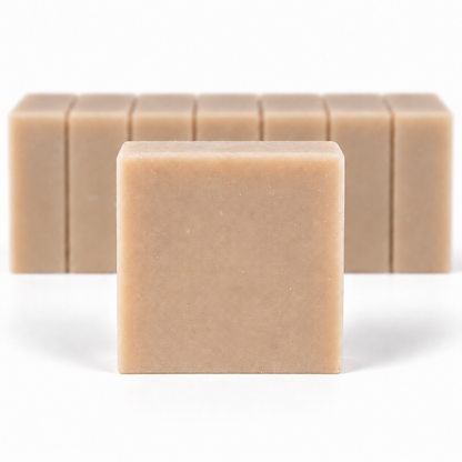 Almond Coconut Soap, with a sharp foreground soap bar and a softly blurred row of bars on a white background.
