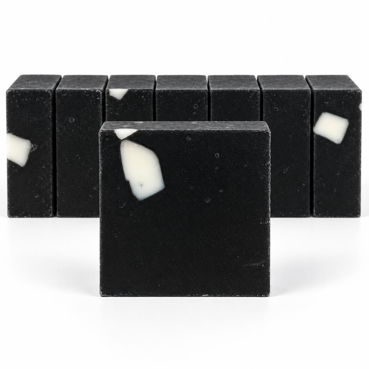 Charcoal Aloe Soap, neatly aligned soap bars in sharp detail on a white background.