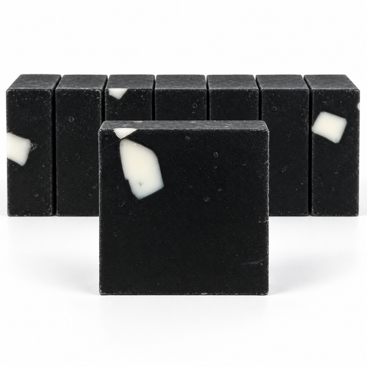 Charcoal Aloe Soap, neatly aligned soap bars in sharp detail on a white background.