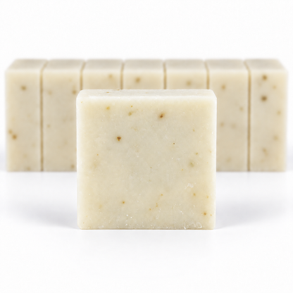 Eucalyptus Lavender Goats Milk, with a sharp foreground soap bar and a softly blurred row of bars on a white background.