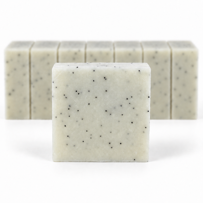 Mechanic's Soap, with a sharp foreground soap bar and a softly blurred row of bars on a white background.