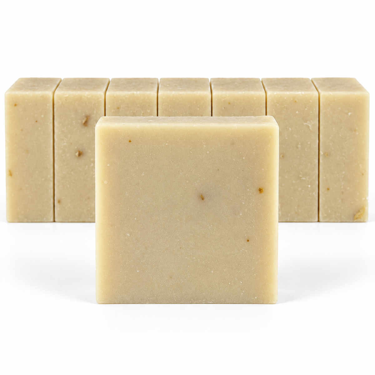 Patchouli Sandalwood Goats Milk, neatly aligned soap bars in sharp detail on a white background.