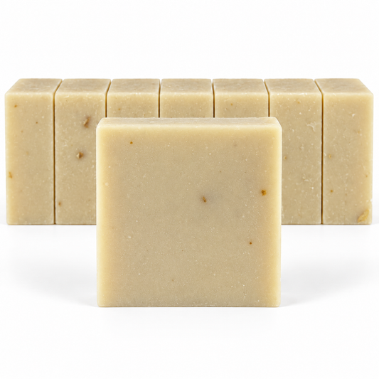 Patchouli Sandalwood Goats Milk, neatly aligned soap bars in sharp detail on a white background.