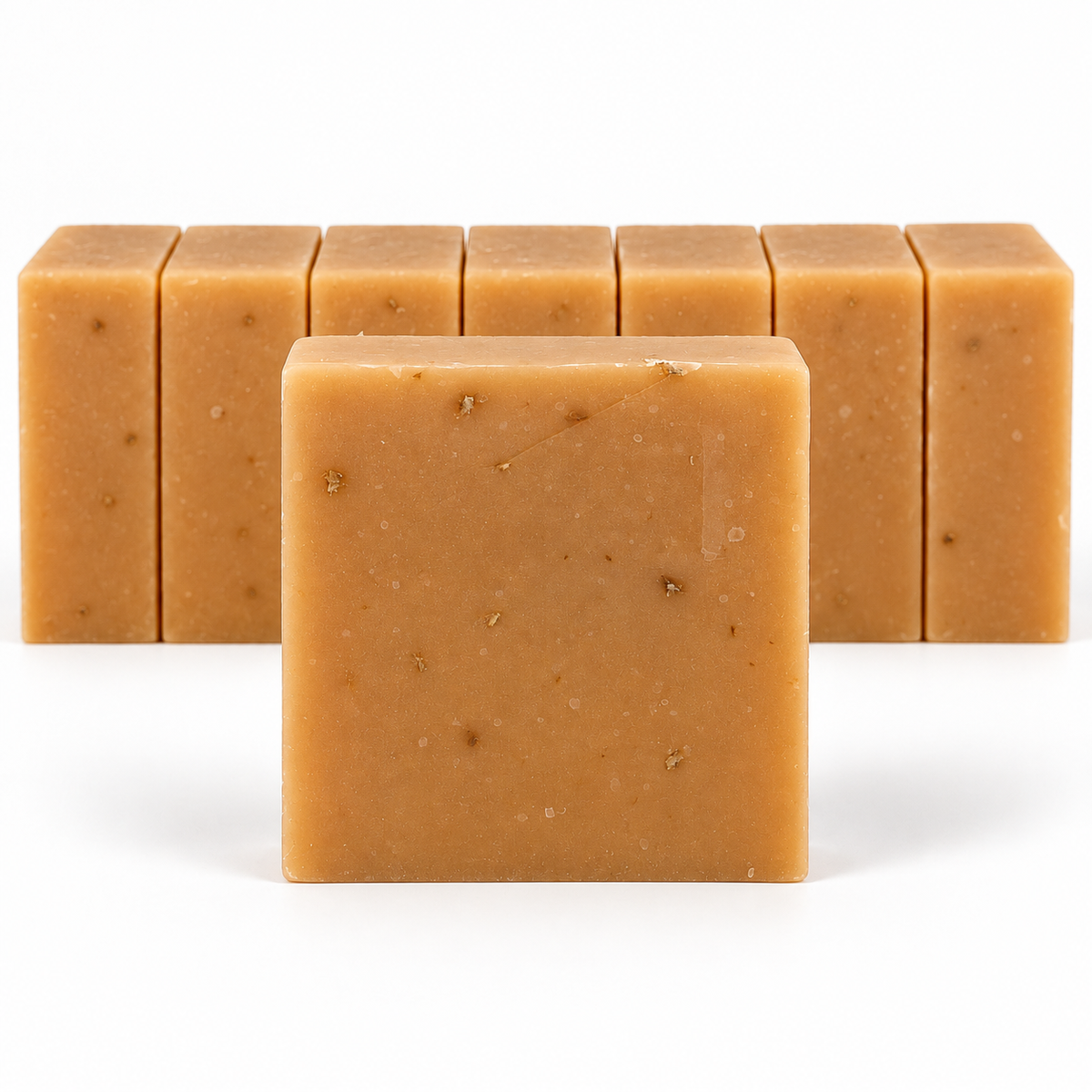 Turmeric Organic Honey & Orange, neatly aligned soap bars in sharp detail on a white background.